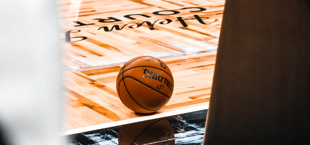 A basketball on the ground at a Orlando Magic game